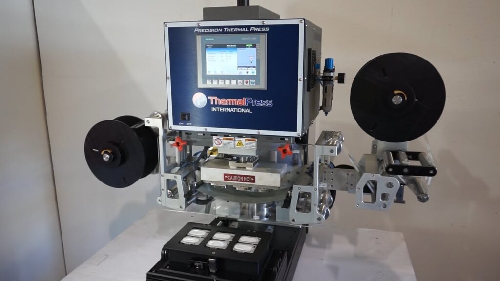 Heat sealing pre-cut filters to wearable medical patch using Thermal Press machine