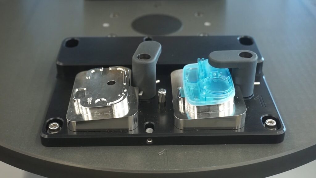 Heat swaging battery into wearable medical device using Thermal Press machine