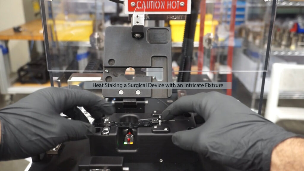 Heat staking surgical device using intricate custom fixture on Thermal Press machine