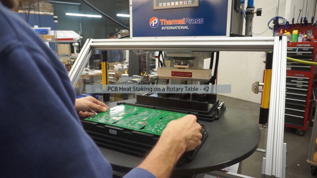 PCB heat staking on a rotary table using C-Series Thermal Press with custom nesting