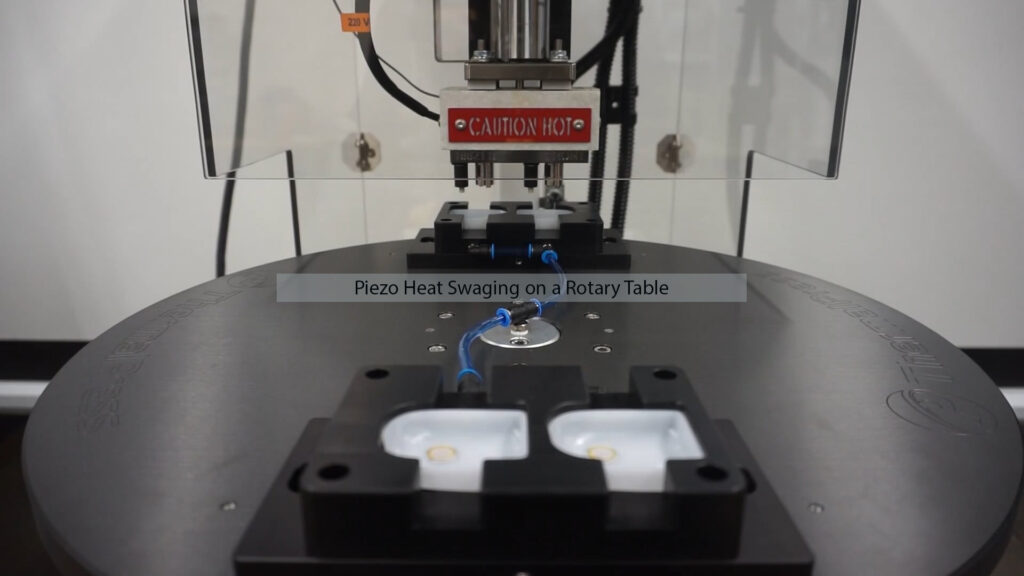 Piezo heat swaging on rotary table using Thermal Press machine